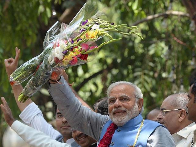 Prime-ministerial-designate-Narendra-Modi-waves-as-he-arrives-at-party-headquarters-in-New-Delhi-AFP-photo Prime-ministerial-designate-Narendra-Modi-waves-as-he-arrives-at-party-headquarters-in-New-Delhi-AFP-photo