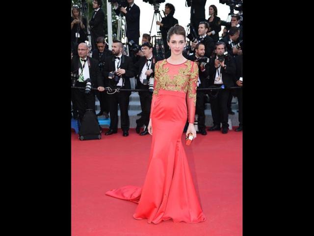 French actor Sarah Barzyk hit the red carpet wearing a silk gown by Christophe Guillarmé. (AFP Photo)
