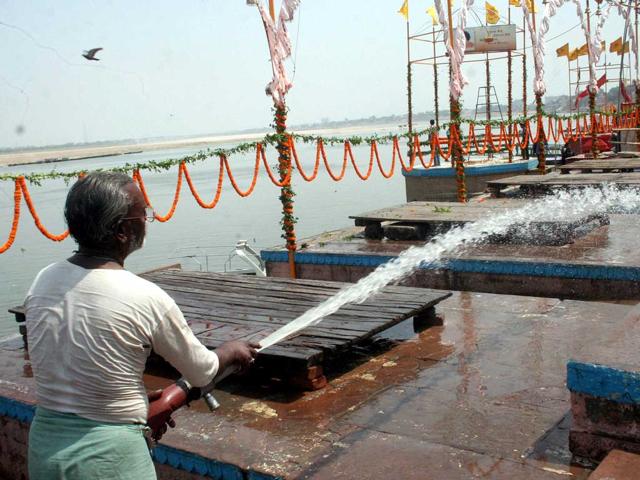 A man washing ghats at the bank of River Ganga where PM-designate Narendra Modi is to perform 'Ganga Aarti' in Varanasi. (PTI Photo)