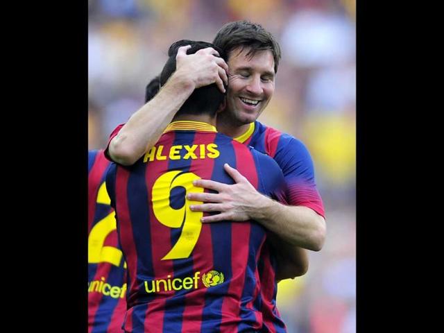 Barcelona's Lionel Messi embraces teammate Alexis Sanchez after he scored his team's first goal during their La Liga match against Barcelona at the Camp Nou stadium in Barcelona. (AP Photo) Barcelona's Lionel Messi embraces teammate Alexis Sanchez after he scored his team's first goal during their La Liga match against Barcelona at the Camp Nou stadium in Barcelona. (AP Photo)