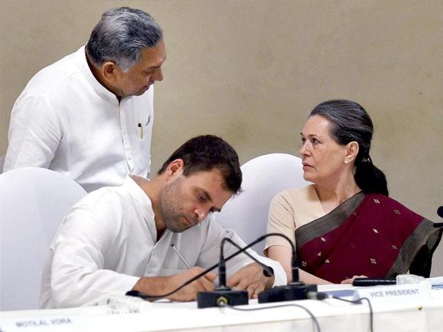 Congress president Sonia Gandhi with party vice president Rahul Gandhi and Janardhan Dwivedi at the CWC meeting at party headquarters in New Delhi. (PTI photo)