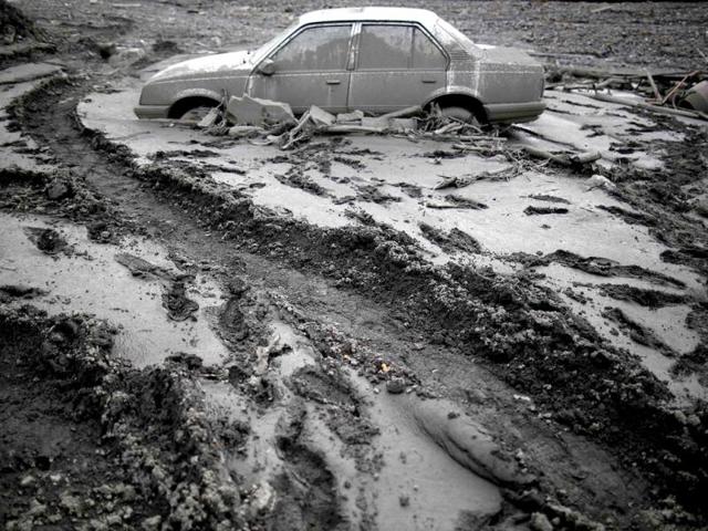 A flood-damaged Opel Astra is seen in Topcic Polje. (Reuters)