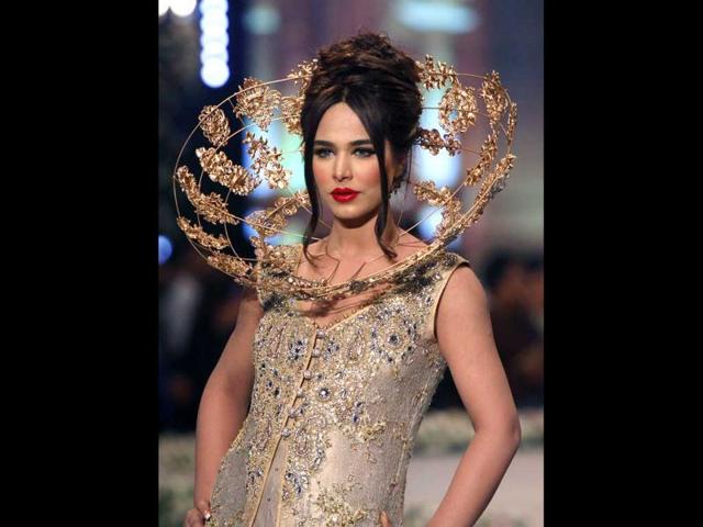 A model presents a creation by designer Tabassum Mughal on the third day of the Bridal Couture Week in Karachi. (AP Photo) A model presents a creation by designer Tabassum Mughal on the third day of the Bridal Couture Week in Karachi. (AP Photo)