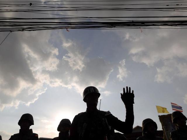 A Thai officer blocks the access to the Army Club where Thailand's army chief held a meeting with all rival factions during a coup in central Bangkok (Reuters photo)