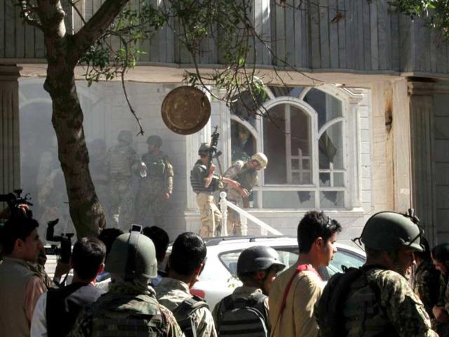 Afghan military personal take position at the scene of an attack on the Indian consulate in Herat. (AFP photo)