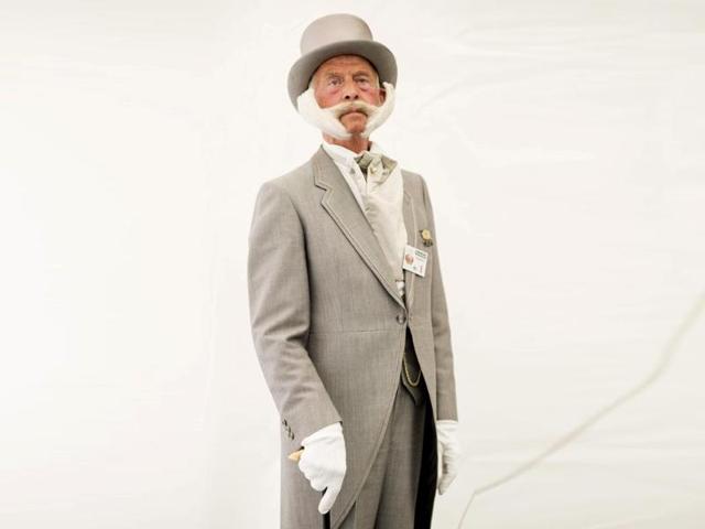 A competitor prepares for the European Beard and Moustache Championships in Urdorf, Switzerland (EPA Photo)