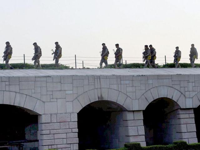 Security personnel keep vigil at Rajghat during the visit by Narendra Modi in New Delhi on Monday. (PTI photo)