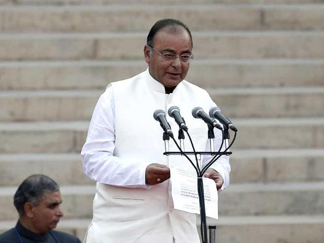 Arun Jaitley is administered oath of office by President Pranab Mukherjee (unseen) as a Cabinet minister at the presidential palace in New Delhi . (Reuters)