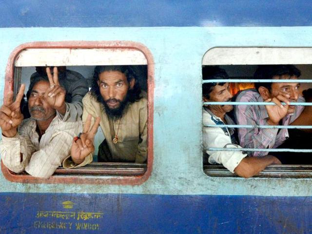Indian fishermen released by Pakistan arrive by train at the Ahmedabad Railway Station. (PTI Photo)