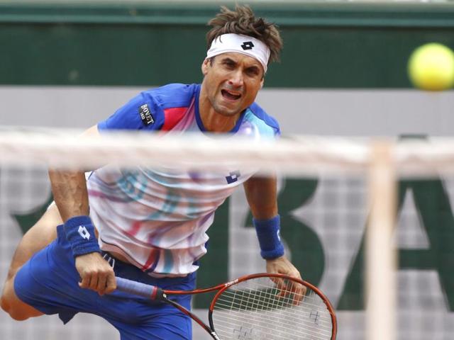 David Ferrer of Spain serves the ball during his second round match against Simone Bolelli of Italy for the French Open at Roland Garros in Paris. (EPA Photo)