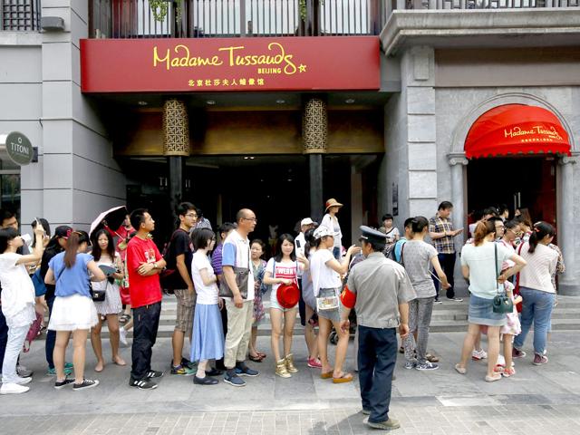 Visitors queue to enter the Madame Tussauds museum in Beijing, China. (EPA Photo)