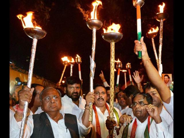 Congress leaders participate in a torch rally on the eve of the Telangana formation day at Gandhi Bhavan in Hyderabad on Sunday.(PTI Photo)