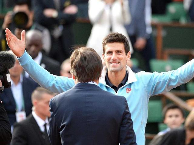 Novak Djokovic of Serbia celebrates his straight sets victory over Milos Raonic of Canada in their quarter-final match during the French Open at Roland Garros in Paris. (EPA Photo)