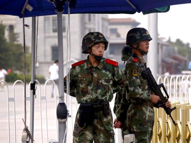 Armed paramilitary police stand guard at Tiananmen Square in Beijing. China deployed its vast security apparatus on Wednesday to snuff out commemoration of the suppression of pro-democracy protests around Tiananmen Square 25 years ago, flooding the streets with police as censors scrubbed the Internet clean of any mention of the crackdown. (Reuters)