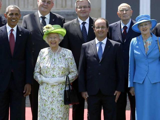 US President Barack Obama (left) and Russian President Vladimir (right) pose during a group photo for the 70th anniversary of the D-Day landings in Benouville. Between Obama and Putin are (left-right) Britian's Queen Elizabeth, French President Francois Hollande and Danish Queen Margrethe II. World leaders and veterans paid tribute on the 70th anniversary of the World War Two D-Day landings to soldiers who fell in the liberation of Europe from Nazi German rule, as host France sought to use the event to achieve a thaw in the Ukraine crisis. (Reuters)