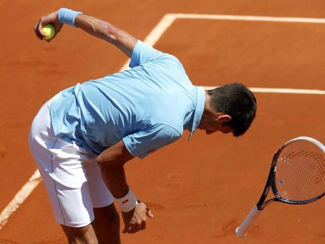 Novak Djokovic of Serbia smashes his racket in frustration during his men's semi-final match against Ernests Gulbis of Latvia at the French Open at Roland Garros in Paris. (Reuters Photo)