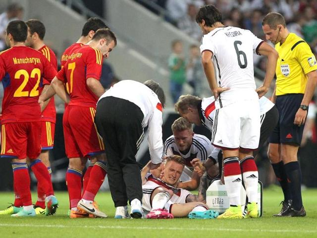 Germany-s-midfielder-Marco-Reus-C-reacts-injured-on-the-pitch-during-the-friendly-football-match-Germany-vs-Armenia-in-preparation-for-the-FIFA-World-Cup-2014-in-Mainz-central-Germany-AFP-photo