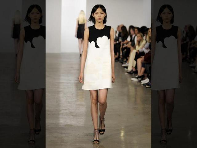 Calvin Klein CollectionThis season's Calvin Klein girl wore coats and dresses in wetsuit neoprene with zipper details, and a light repeated floral motif. Designer Francisco Costa stuck with a typically restrained color palette.