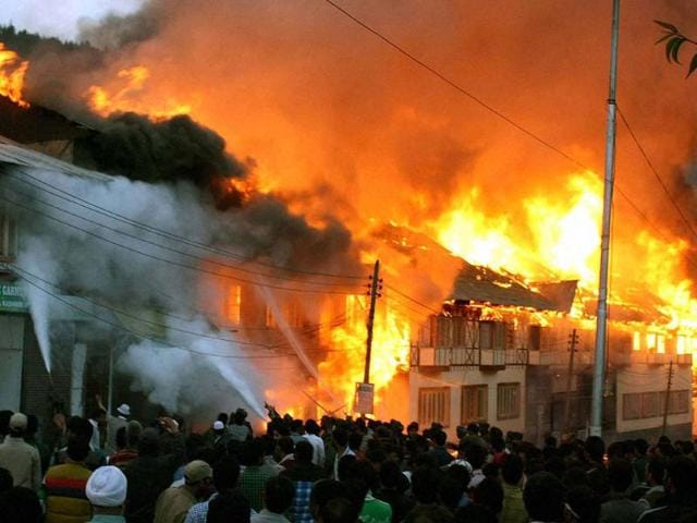 Fire-fighters-try-to-douse-flames-emanating-from-hotels-and-shops-in-the-Pahalgam-market-The-fire-gutted-dozens-of-hotels-and-shopping-malls-on-Monday-evening-PTI-Photo