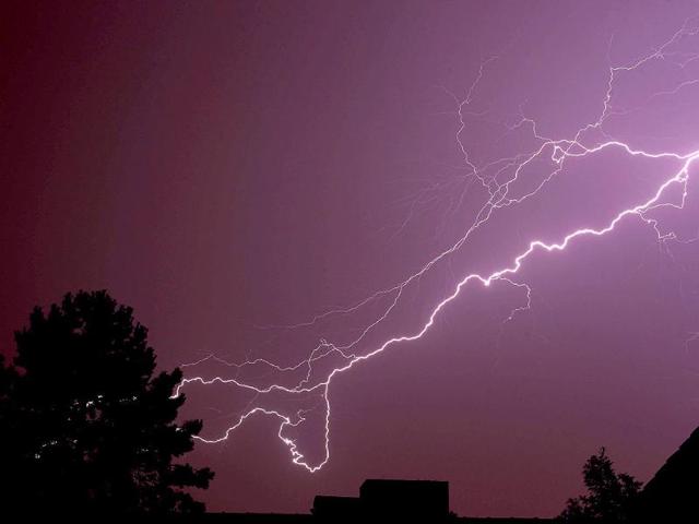 A lightning strike during a thunderstorm over Gavere, Belgium. (AFP photo)