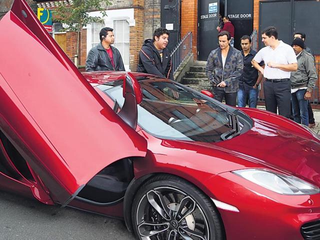 We’re informed that Saif, who loves expensive and fancy cars, was delighted at the sight of a rare sports car, which was on display at a showroom. (HT Photo)