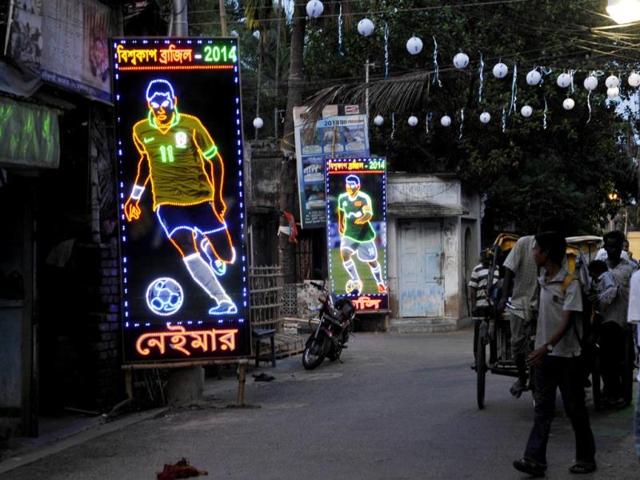 Roads and bylanes being decorated with flags of participating countries and colorful flex of the players at Ganguly Bagan in South Kolkata on the eve of World Cup 2014. (Subhendu Ghosh/HT Photo) 