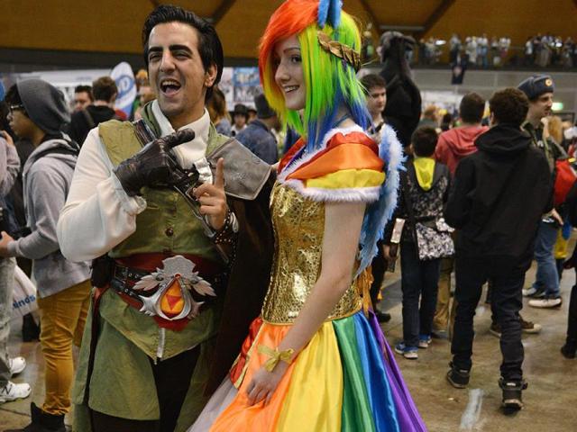 People dressed in costume pose for photos as they attend the Supanova Pop Culture Expo in Sydney. (AFP photo)