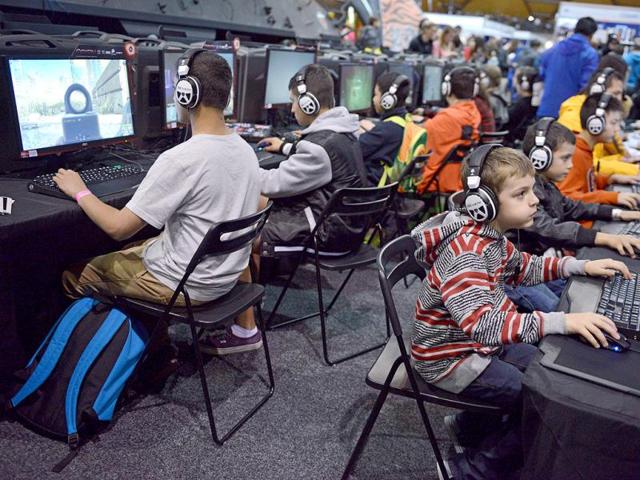 Gamers play video games as they attend the Supanova Pop Culture Expo in Sydney. (AFP photo)