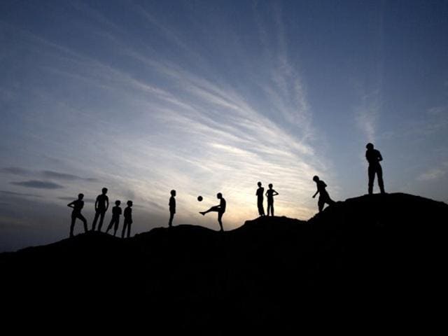 Beit Lahia: A picture showing Palestinian boys playing football in Beit Lahia in the northern Gaza Strip. (AFP PHOTO)