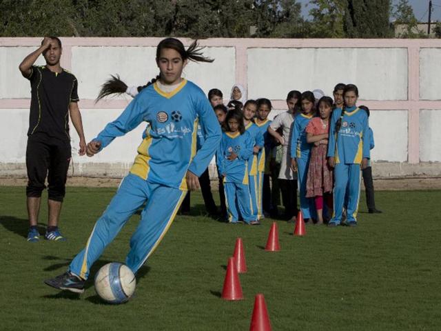 Beit Lahia: Palestinian girls take part in a training session at the Beit Lahia football club as part of an after-school sport program funded by the Palestine Association for Children’s Encouragement of Sports (PACES). (AFP PHOTO)