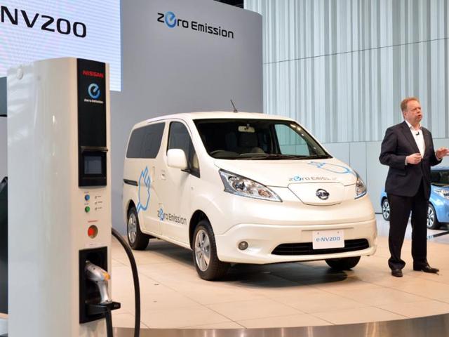 Chief-planning-officer-for-Japan-s-auto-giant-Nissan-Andy-Palmer-R-speaking-about-the-company-s-new-commercial-electric-vehicle-e-NV200-at-the-company-s-headquarters-in-Yokohama-suburban-Tokyo-Photo-AFP Chief-planning-officer-for-Japan-s-auto-giant-Nissan-Andy-Palmer-R-speaking-about-the-company-s-new-commercial-electric-vehicle-e-NV200-at-the-company-s-headquarters-in-Yokohama-suburban-Tokyo-Photo-AFP