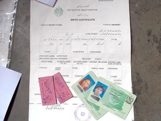 The ID cards of Laxman's son and daughter-in-law, along with the tickets of the last bus that brought them to the Pakistan - India border. (Saumya Khandelwal/ HT Photo)