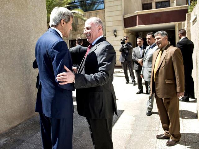 Iraqi speaker of parliament Usama al-Nujayfi greets John Kerry. (Reuters photo)