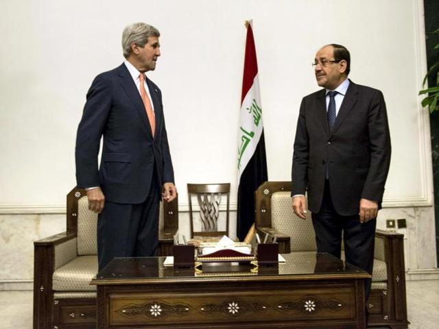 Iraqi Prime Minister Nuri al-Maliki and John Kerry meet at the Prime Minister's ofice in Baghdad. (Reuters photo)