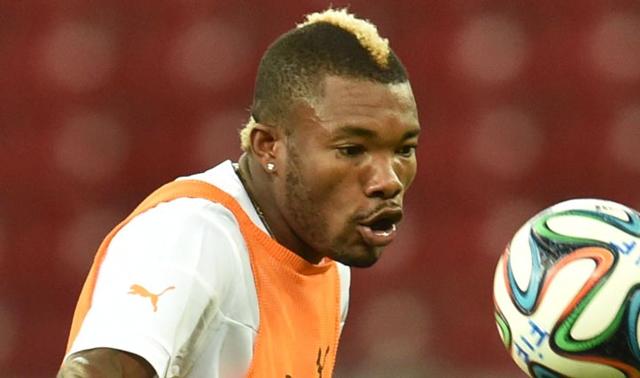 Serey Die, Ivory Coast Die is probably pulling a Mario Balotelli with a blonde faux-hawk. Balotelli, take note. (AP Photo)