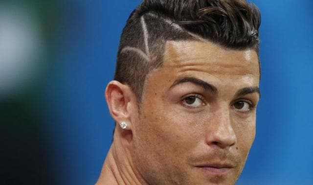 Cristiano Ronaldo, Portugal Ronaldo's seemingly awry hairdo is one of the sweetest gestures in the football history. The hairdo is a replicated from Ronaldo's fan who has cancer. (AP Photo)