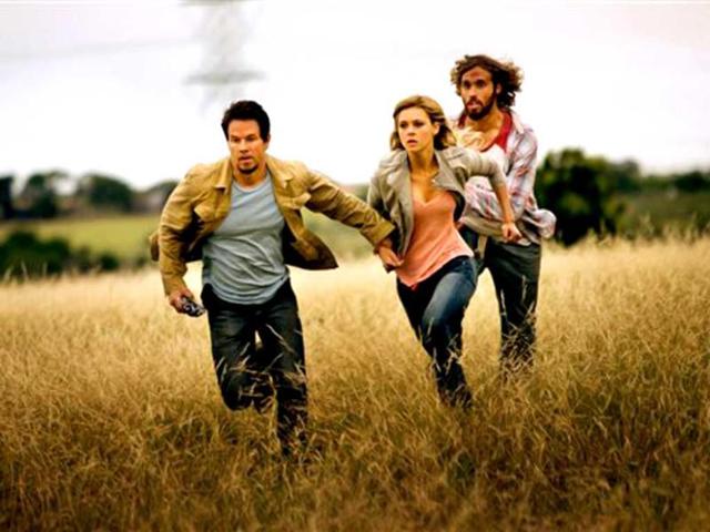 Mark Wahlberg, as Cade Yeager, Nicola Peltz as Tessa Yeager, and TJ Miller as Lucas Flannery, in Transformers: Age of Extinction. (AP Photo)