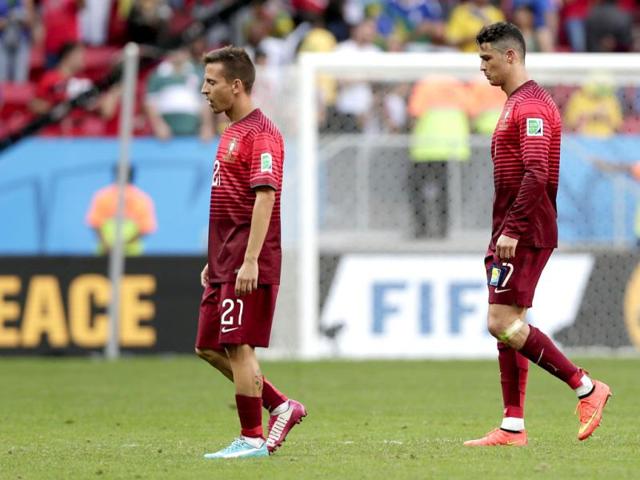 Portugal-s-Cristiano-Ronaldo-right-and-Joao-Pereira-leave-the-pitch-after-the-Group-G-World-Cup-match-between-Portugal-and-Ghana-at-the-Estadio-Nacional-in-Brasilia-Brazil-on-Thursday-Ronaldo-s-first-goal-of-the-World-Cup-earned-Portugal-a-2-1-win-over-Ghana-but-couldn-t-prevent-his-team-being-eliminated-from-the-tournament-along-with-the-Africans-AP-Photo Portugal-s-Cristiano-Ronaldo-right-and-Joao-Pereira-leave-the-pitch-after-the-Group-G-World-Cup-match-between-Portugal-and-Ghana-at-the-Estadio-Nacional-in-Brasilia-Brazil-on-Thursday-Ronaldo-s-first-goal-of-the-World-Cup-earned-Portugal-a-2-1-win-over-Ghana-but-couldn-t-prevent-his-team-being-eliminated-from-the-tournament-along-with-the-Africans-AP-Photo