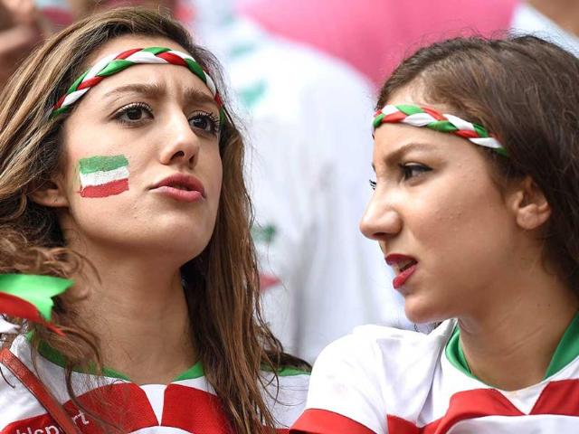 Iran fans look on before a Group F football match between Bosnia-Hercegovina and Iran at the Fonte Nova Arena in Salvador. (AFP Photo) Iran fans look on before a Group F football match between Bosnia-Hercegovina and Iran at the Fonte Nova Arena in Salvador. (AFP Photo)