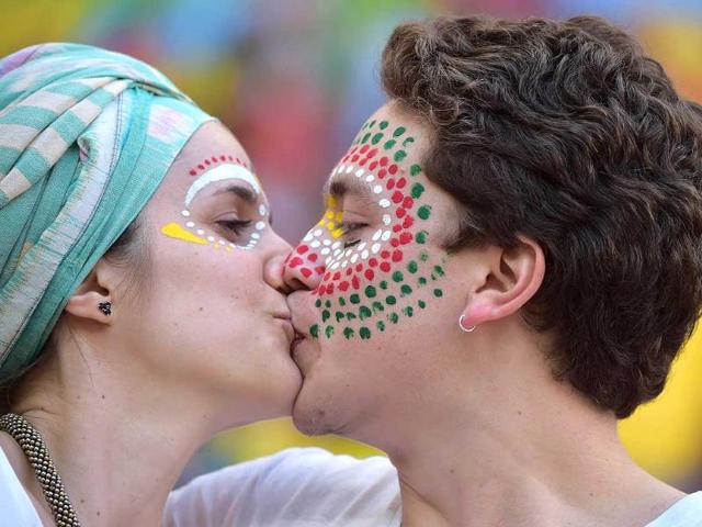 Portugal's fans kiss prior to their Group G match against Ghana at the Mane Garrincha National Stadium in Brasilia. (AFP Photo) Portugal's fans kiss prior to their Group G match against Ghana at the Mane Garrincha National Stadium in Brasilia. (AFP Photo)