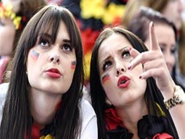 German fans watch the group G football match Germany vs USA on a giant screen in Berlin. (AFP PHOTO) German fans watch the group G football match Germany vs USA on a giant screen in Berlin. (AFP PHOTO)