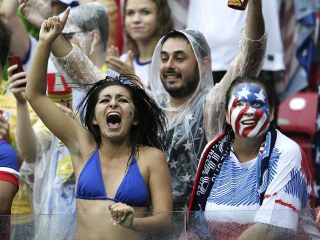 US fans celebrate after their team advanced to the round of 16 despite losing 0-1 to Germanyin Recife, Brazil. (AP Photo) US fans celebrate after their team advanced to the round of 16 despite losing 0-1 to Germanyin Recife, Brazil. (AP Photo)
