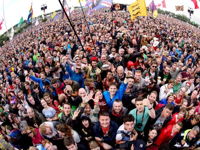 Fans wait for British band, Elbow to perform on the Pyramid Stage, on the first official day of the Glastonbury Festival of Music and Performing Arts in Somerset, southwest England. (AFP photo)