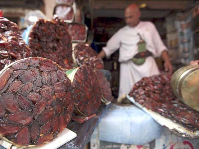 A vendor displays dates at a market in Yemen in preperation of Ramadan. (Reuters photo)