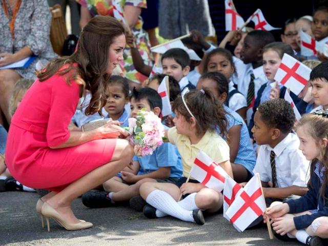 The Duchess of Cambridge stepped out in a crisp red dress for her recent visit to the Blessed Sacrament School here. (AP)