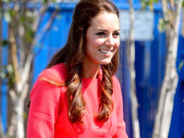 Kate Middleton stepped out in a crisp red dress for a recent visit to a London school. (AP)
