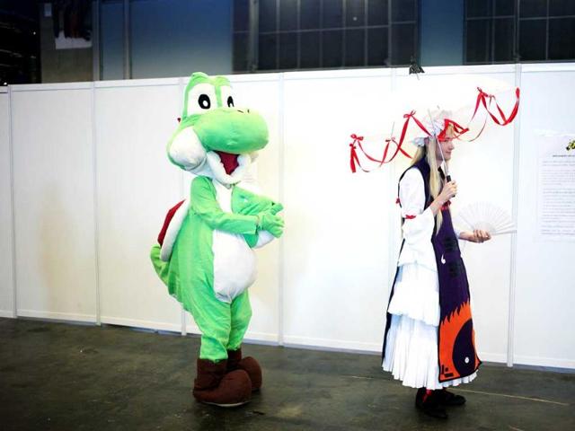 People dressed like manga characters attend the 15th edition of the "Japan Expo" exhibition, Villepinte (AP Photo)