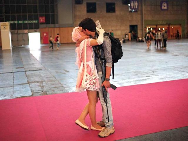 A couple kiss during the 15th edition of the "Japan Expo" exhibition, Villepinte (AP Photo)