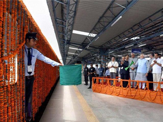 PM Narendra Modi with railway minister Sadananda Gowda, governor of Jammu & Kashmir, NN Vohra, J&K CM Omar Abdullah flagging off the first train to Udhampur, from Katra Railway Station. (PTI photo)