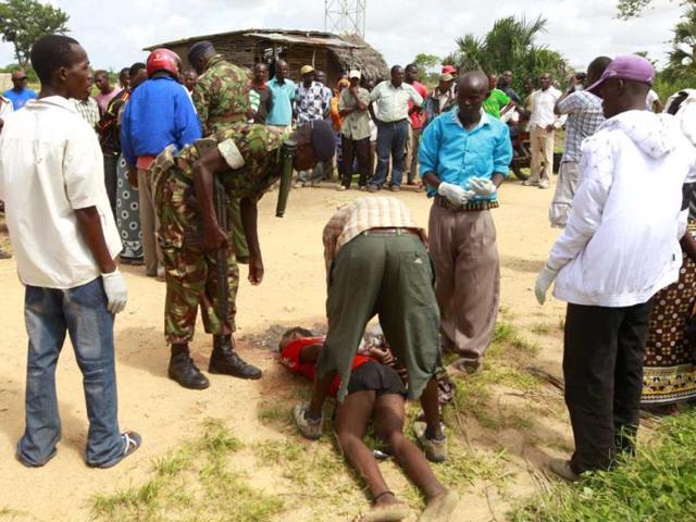 Policemen-recover-the-slain-body-of-a-man-killed-when-gunmen-attacked-Hindi-village-near-Kenya-s-coastal-town-of-Lamu-Reuters-photo Policemen-recover-the-slain-body-of-a-man-killed-when-gunmen-attacked-Hindi-village-near-Kenya-s-coastal-town-of-Lamu-Reuters-photo